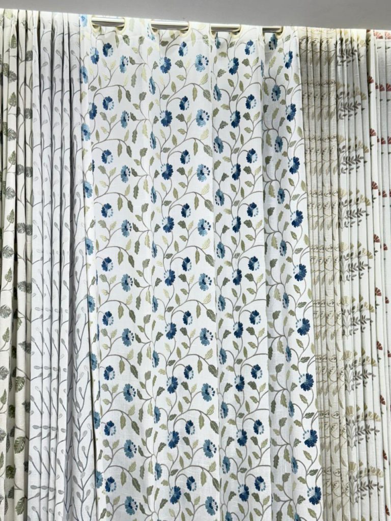 fabric curtains with a floral vine print at Ask Furnishing Gallery - Curtain Shop in Pune